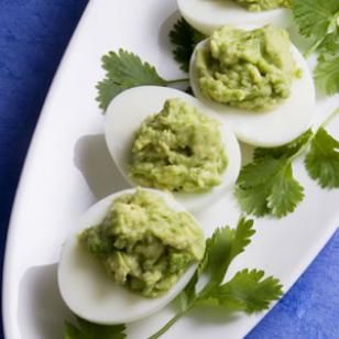 Green Deviled Eggs - Stuffed with Guacamole (mashed avocado, olive oil, pepper, salt, lime chilli)