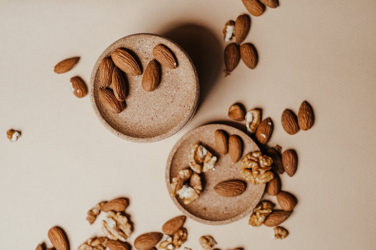 overhead shot of brown walnuts and almonds